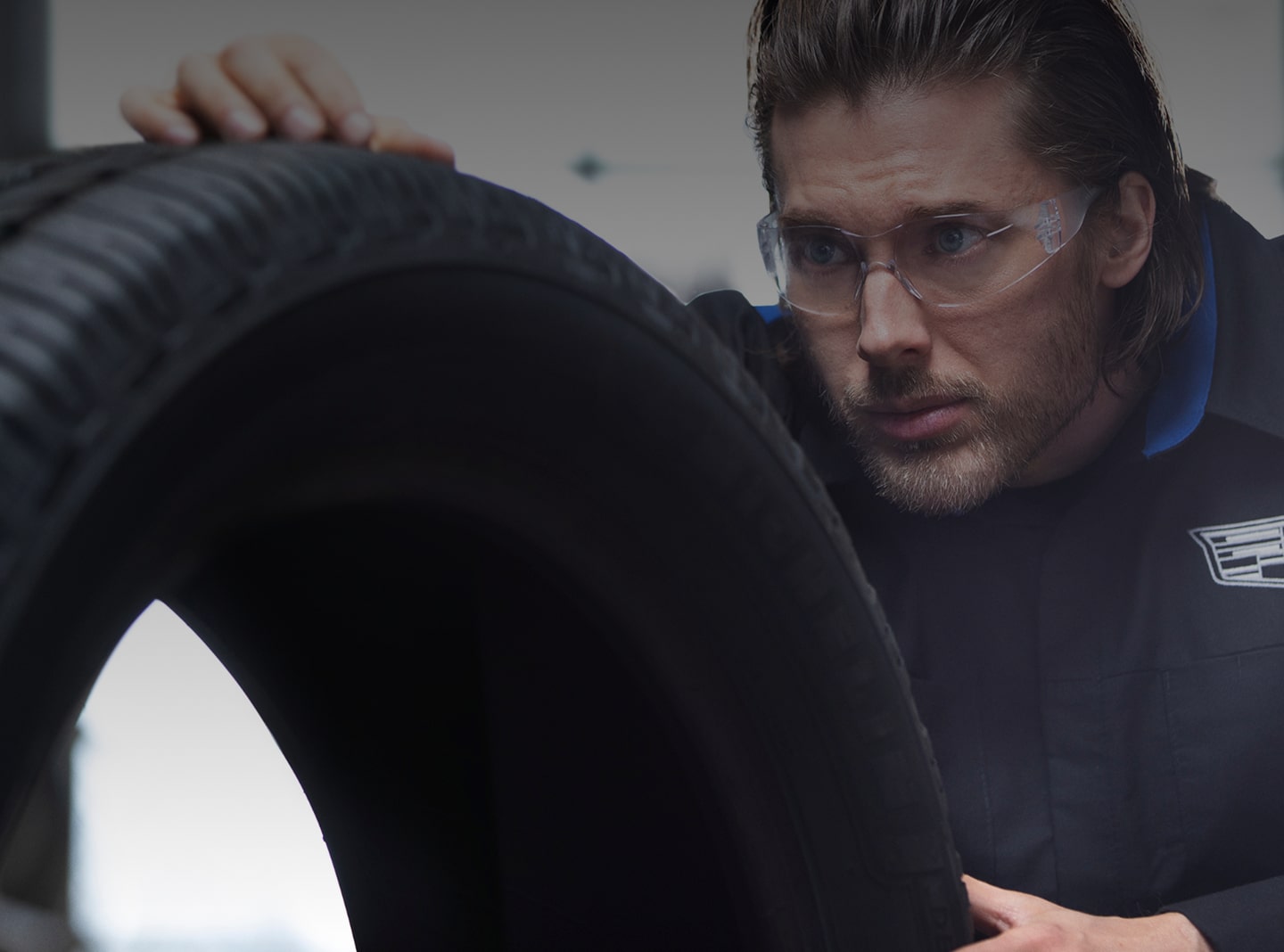 A Service Technician Inspecting a Tire