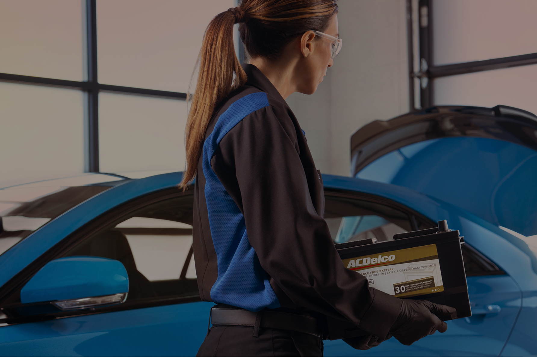 A Service Technician Working on the Battery of a Vehicle