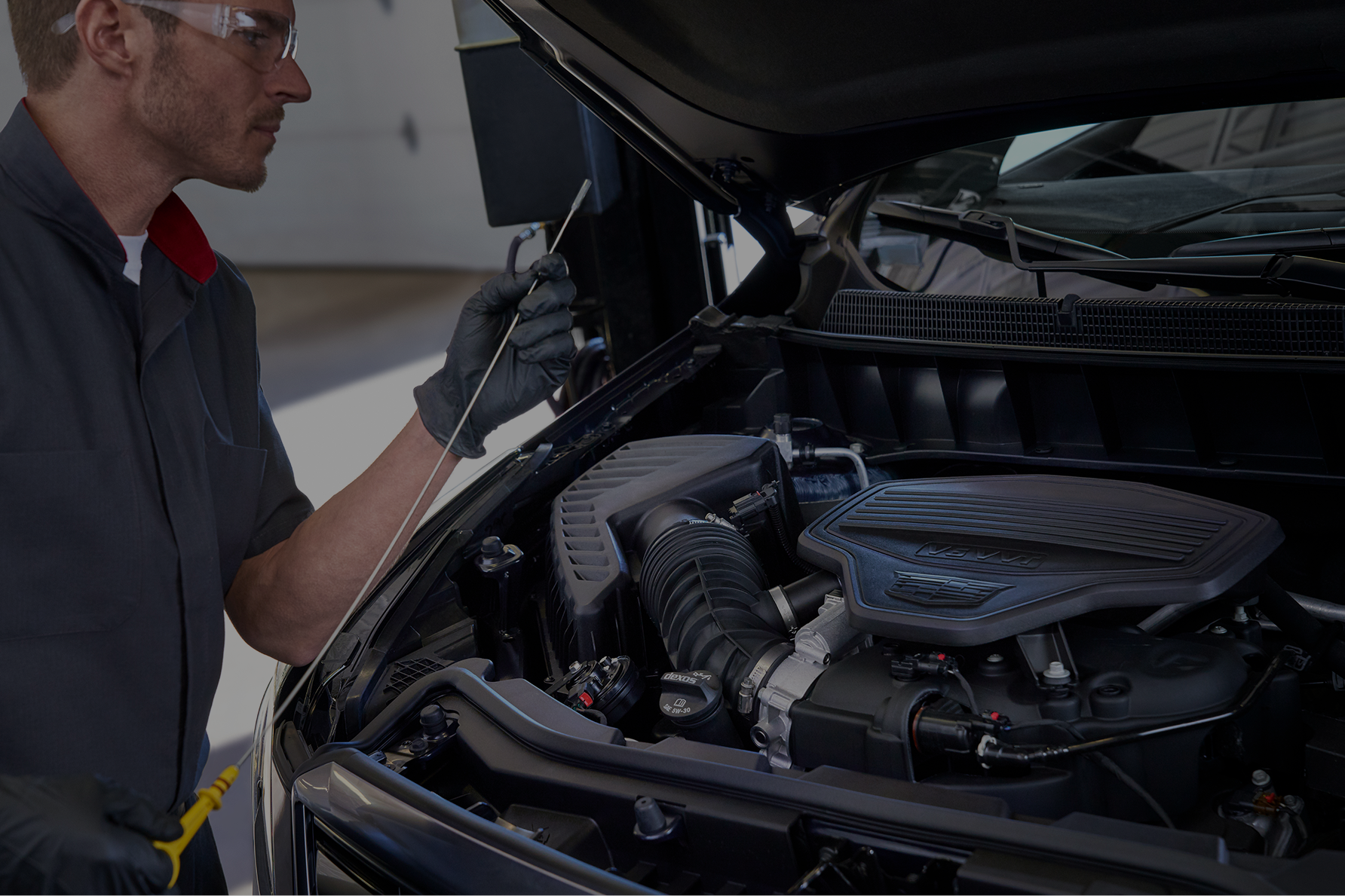 The Hands of a Service Technician Working on a Transmission