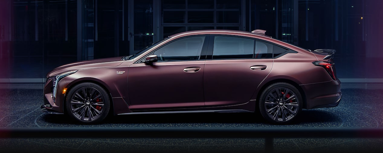 Profile View of the Curated by Cadillac CT5-V Blackwing Parked in a Dark Showroom