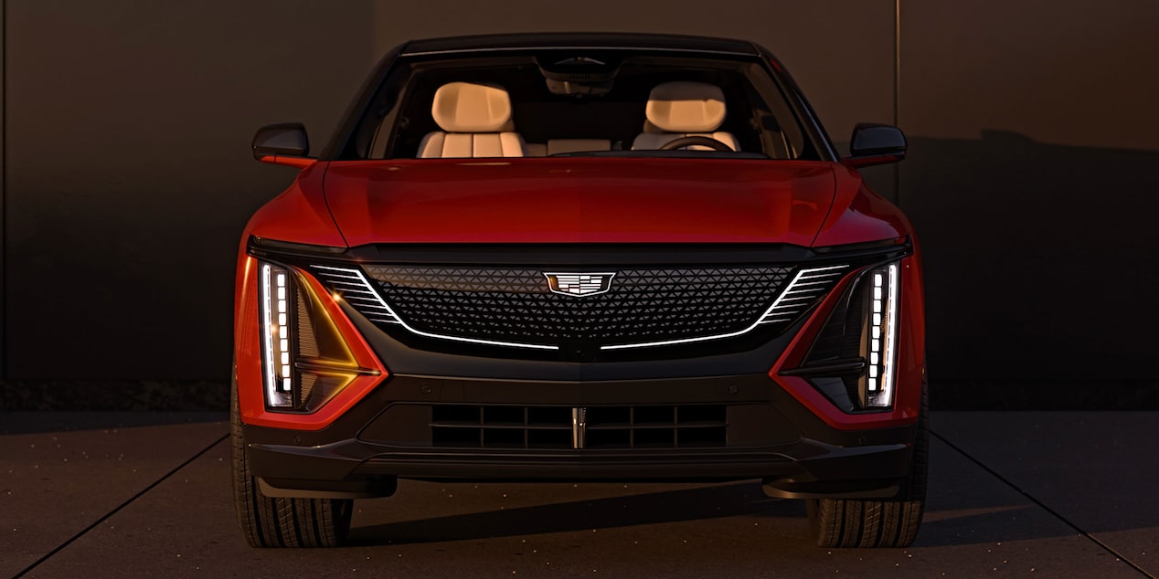 Front View of a Red 2027 Cadillac LYRIQ Displayed in a Studio Environment.
