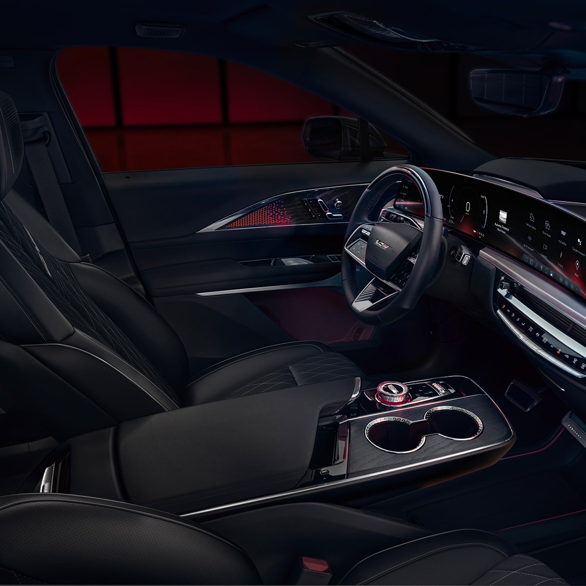 Interior de Cadillac LYRIQ-V 2027 con asientos de piel Negro y controles de la consola central.
