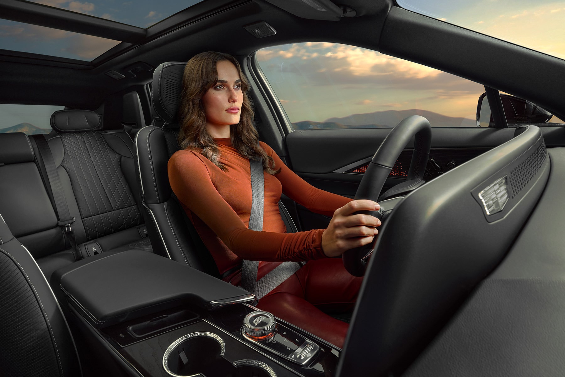 Person Driving a 2027 Cadillac LYRIQ With Black Leather Seating and Interior Cabin Views.