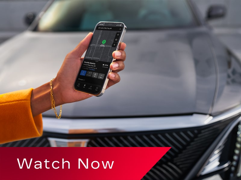 Video Thumbnail Showing a Smartphone Displaying the myCadillac Mobile App Near a 2027 Cadillac LYRIQ.
