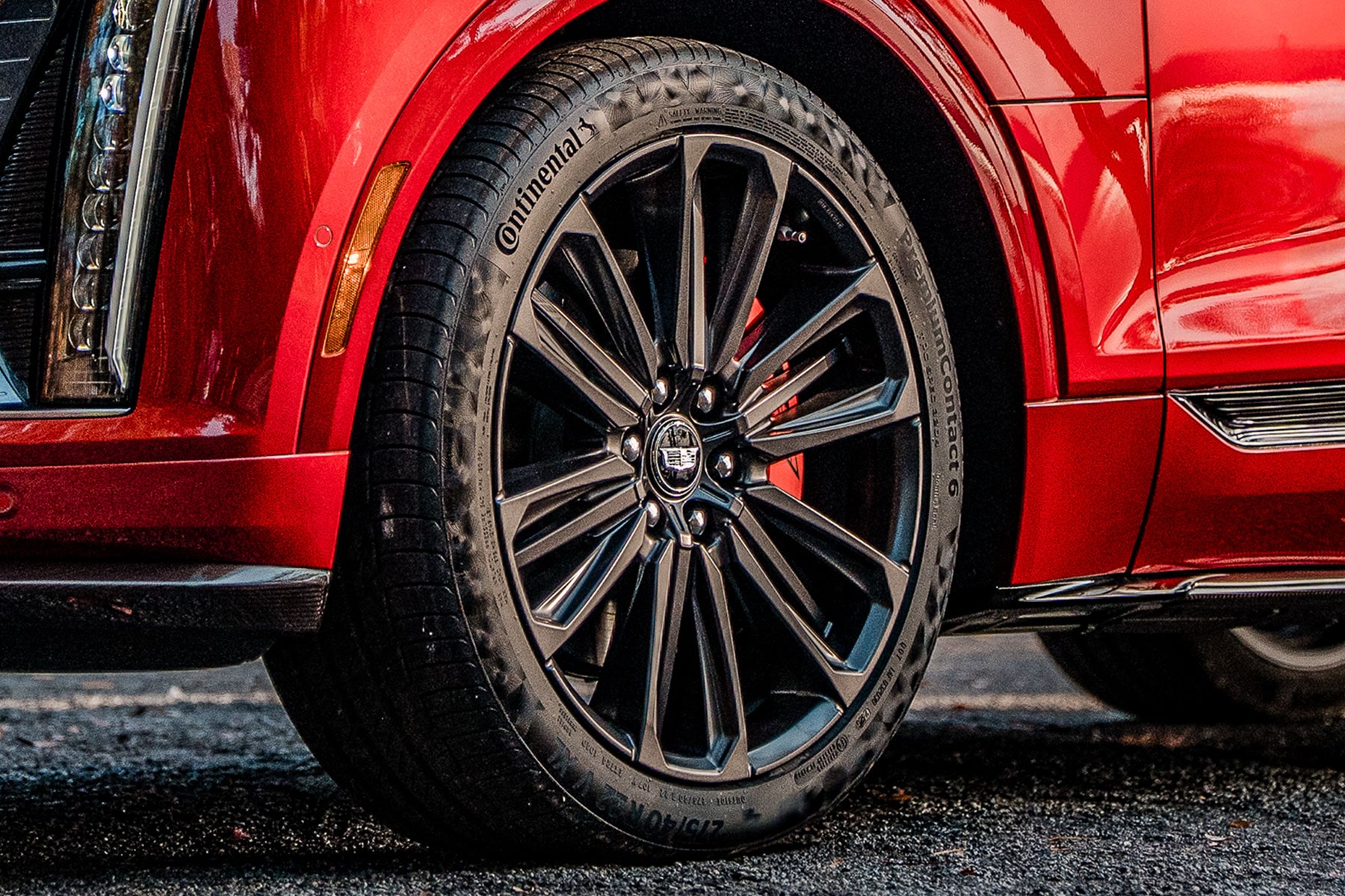 Front Wheel and Tire of a Red 2027 Cadillac LYRIQ-V.