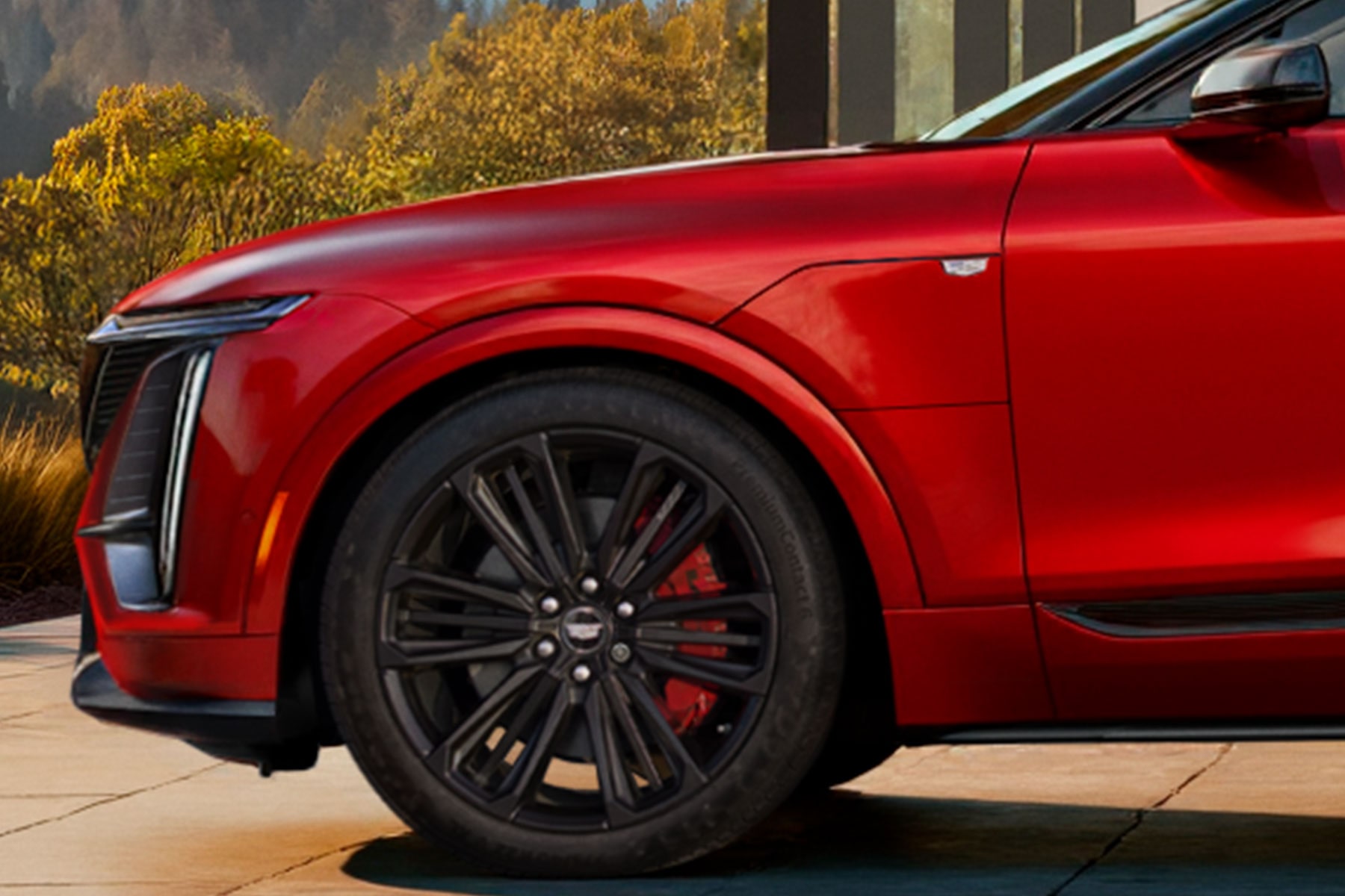 Front Wheel and Side Profile of a Red 2027 Cadillac LYRIQ-V.