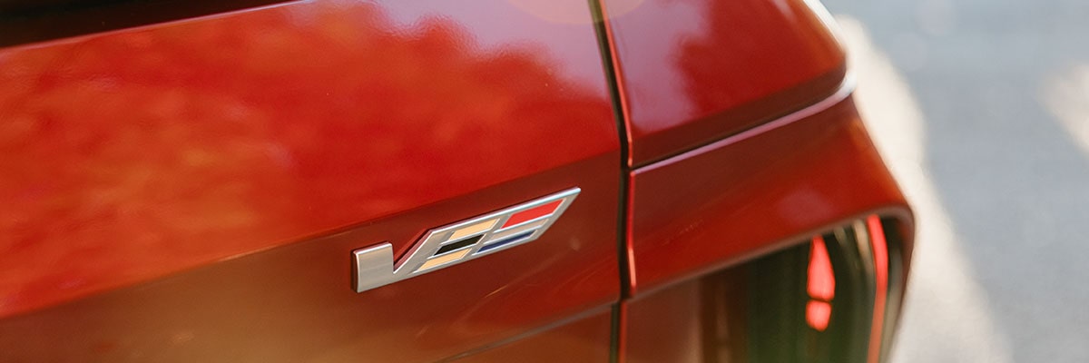 Rear V-Series Badge on a Red 2027 Cadillac LYRIQ-V.