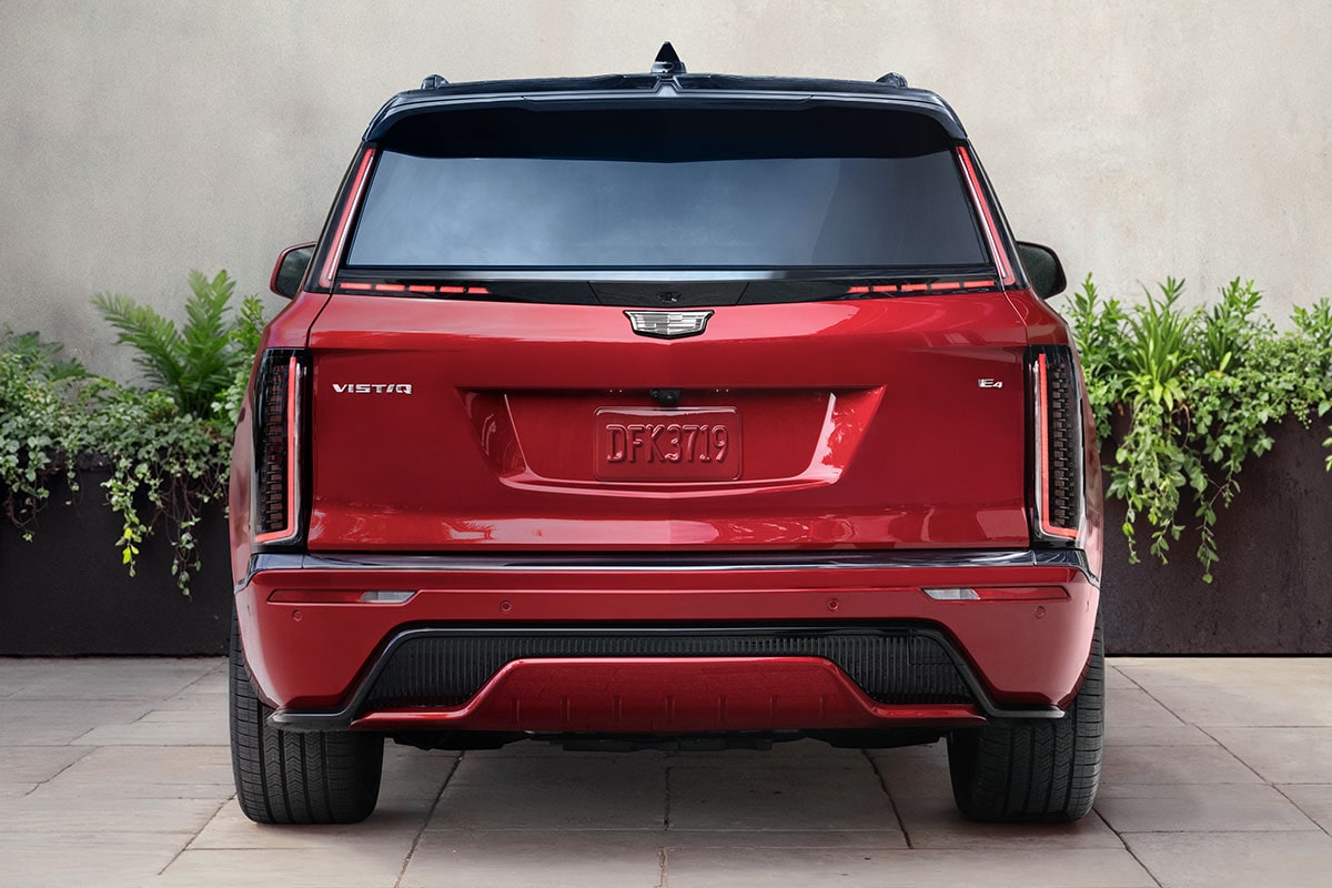 Rear View of a Red 2027 VISTIQ Parked on a Concrete Driveway