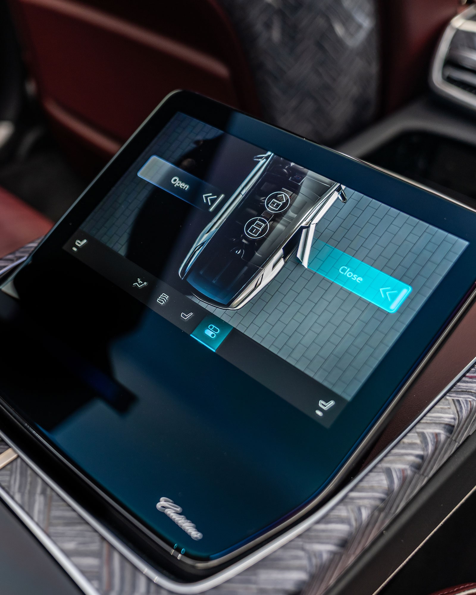 A Tablet-Like Control Screen in the Cadillac CELESTIQ Rear Console, Displaying Various Car Functions.