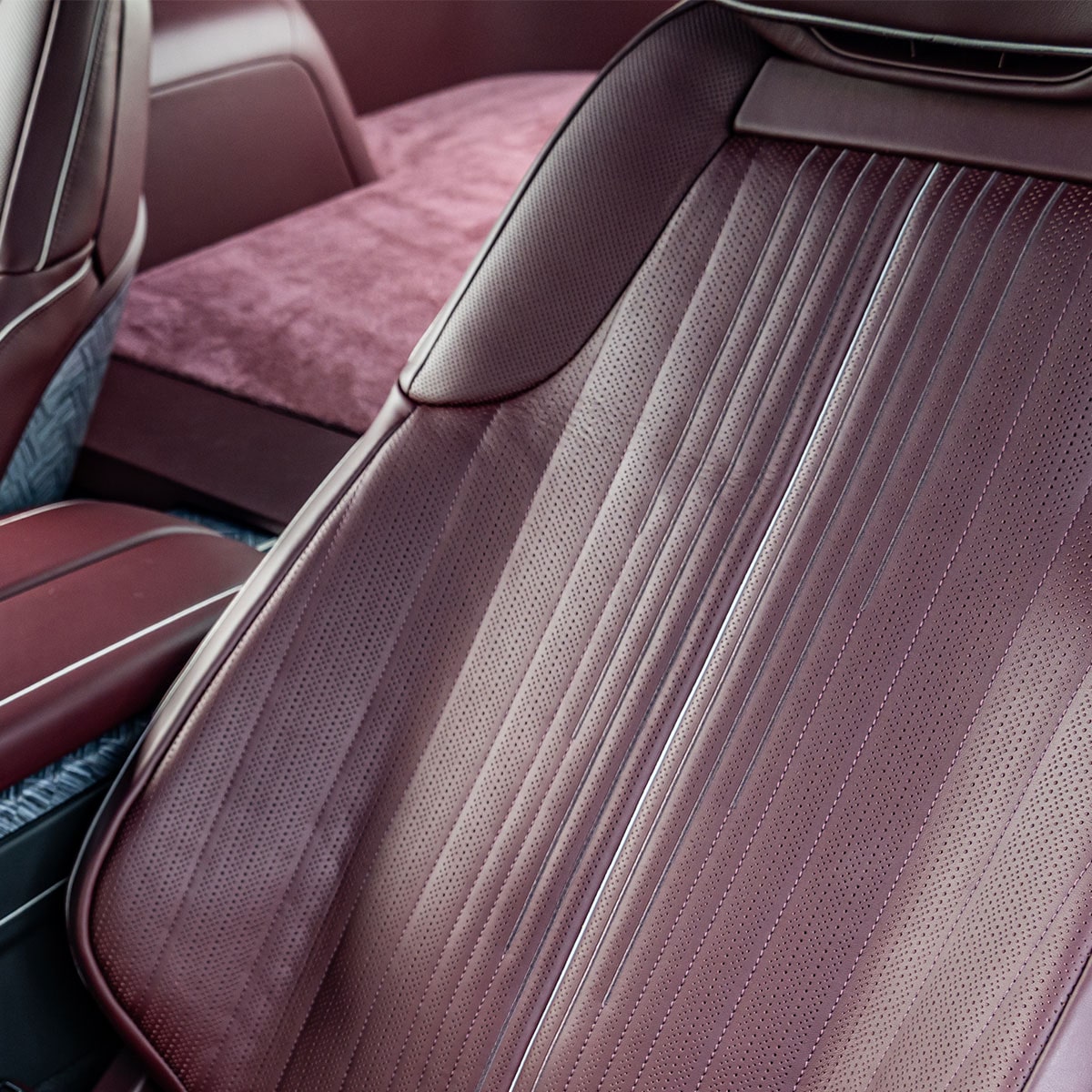The Cadillac CELESTIQ Rear Passenger Area, Featuring Foldable Tray Tables and Brown Leather Seats.