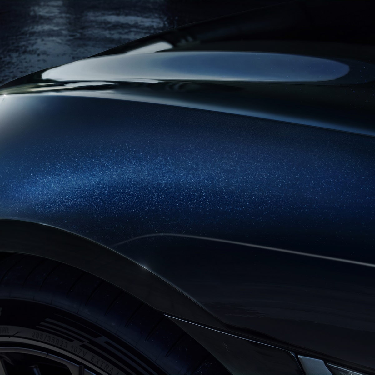 A Close-Up View of the Metallic Bodywork of a Cadillac CELESTIQ Highlighting Sculpted Curves, Reflective Paint Finish, and Precision Exterior Design Details.
