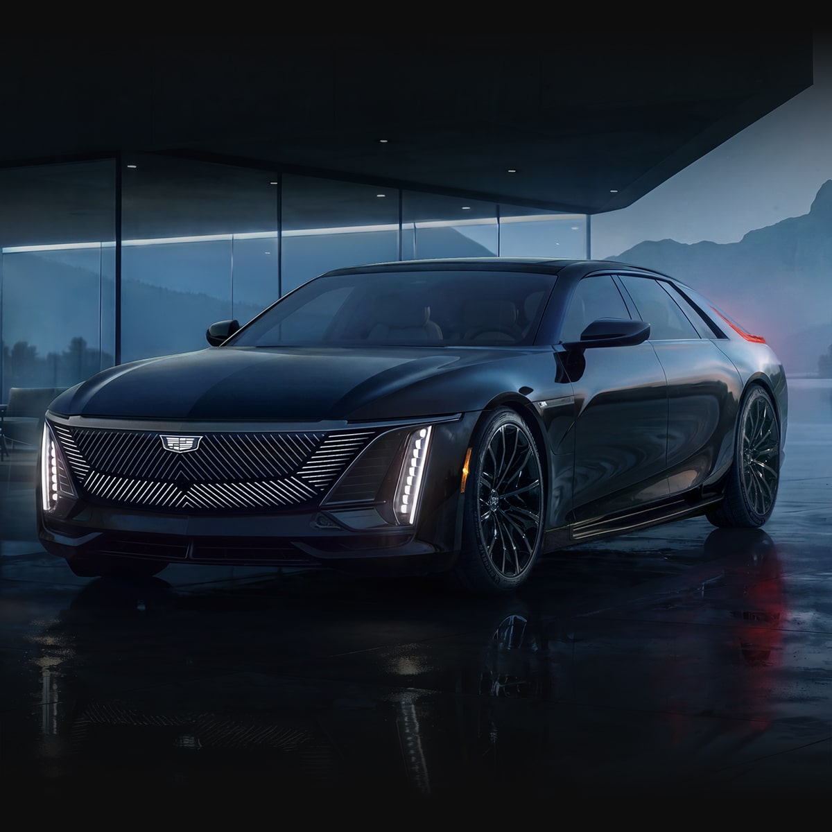 A Black Cadillac CELESTIQ Luxury Sedan Parked on a Rain-Soaked Surface Outside a Modern Glass Building With Illuminated Vertical Lighting and Reflections Across the Wet Pavement.