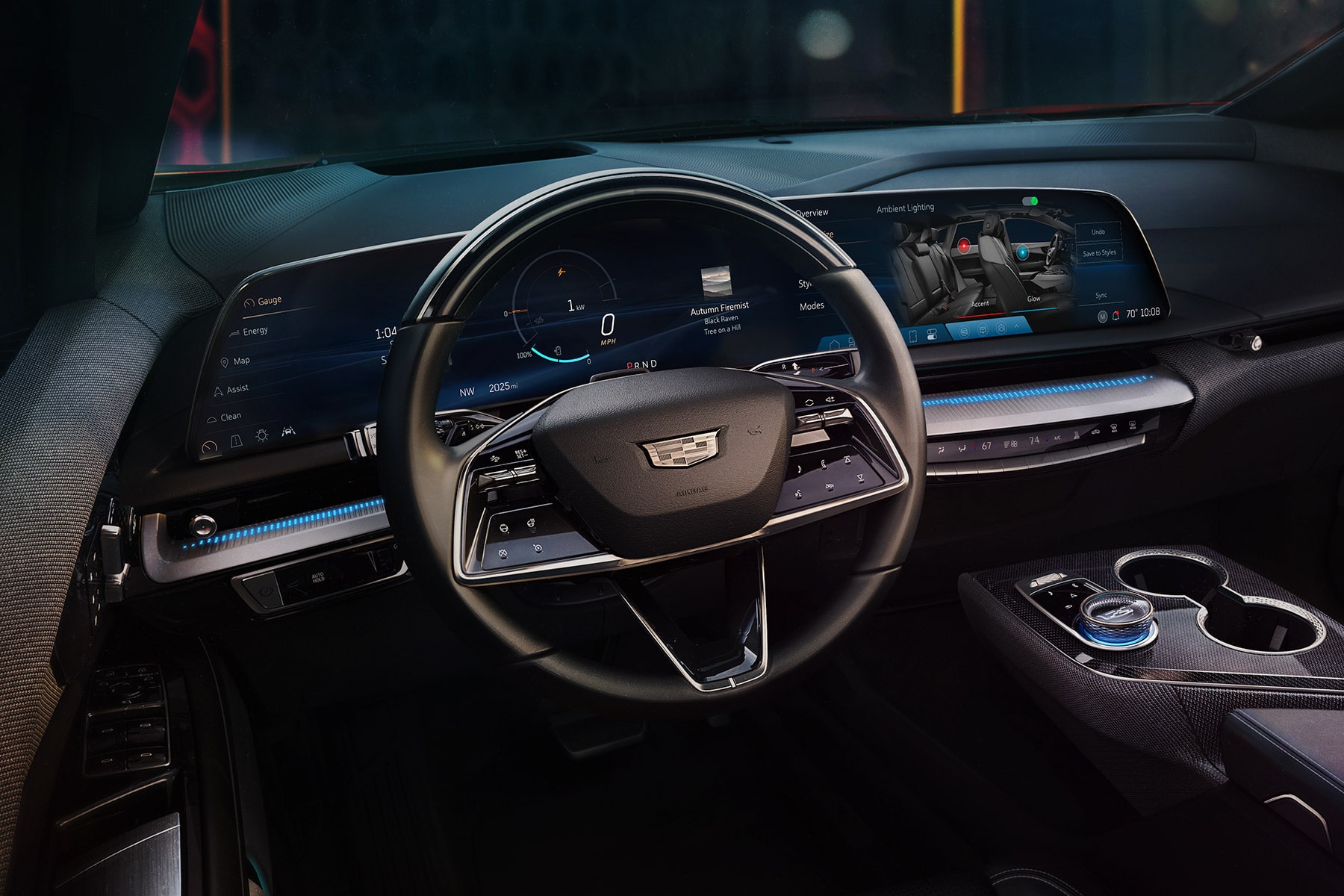 Driver Seat View of the Cadillac OPTIQ's Steering Wheel and All-black Dashboard