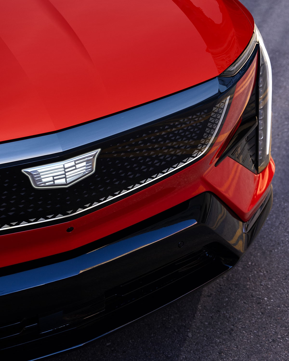 Close-up of the Cadillac Crest Emblem on the Cadillac OPTIQ's Grille