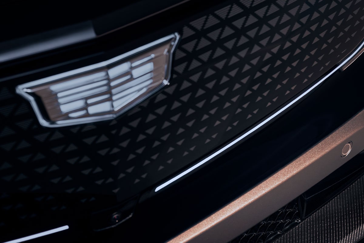 Close-up of the Cadillac Crest Emblem on a Vehicle's Grille
