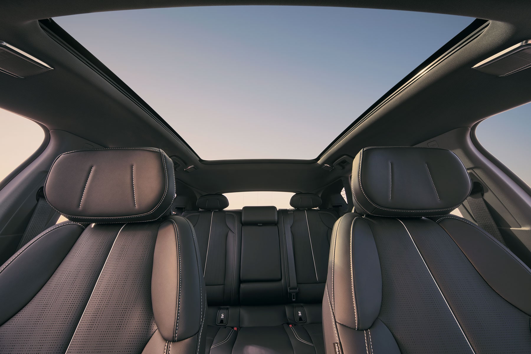 Dashboard View of the Cadillac OPTIQ's Two Rows of Seats and the Skyglass Roof