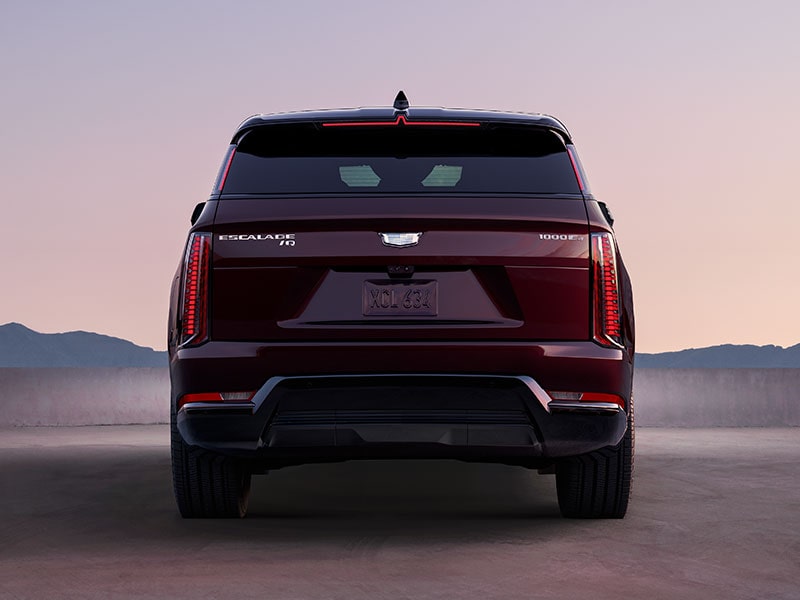 Rear End View of a 2026 ESCALADE IQ Parked in the Desert During Dusk