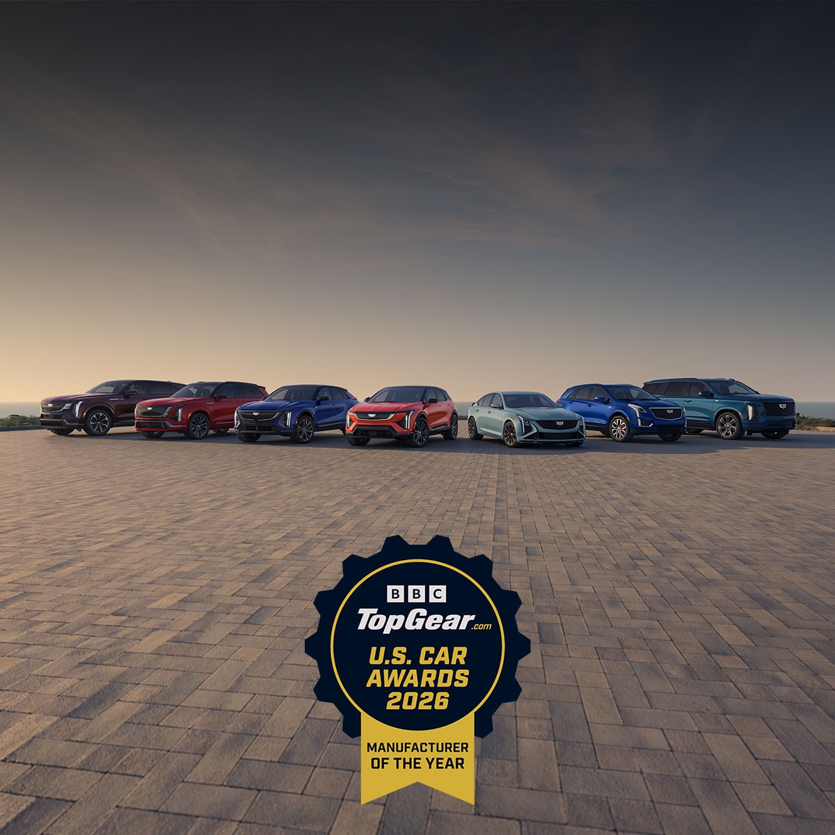 The Entire Cadillac Vehicle Lineup Parked on a Paved Lot at Sunset with the TopGear Manufacturer of the Year 2026 Award Badge