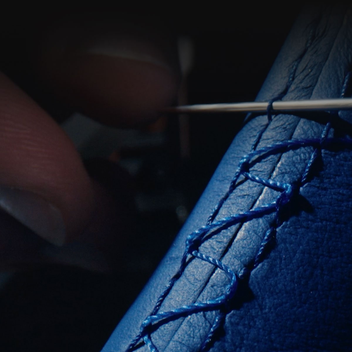 Close-up of the Hand-built Premium Materials in the CELESTIQ Being Stitched by Designer