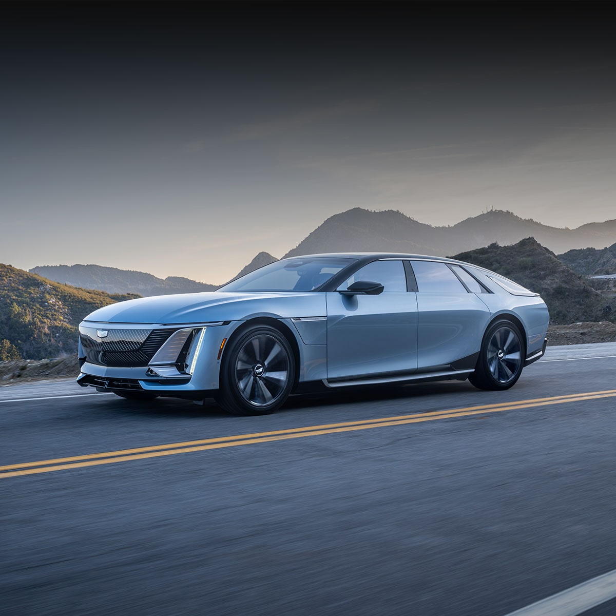 Three-quarters Driver Side View of the Cadillac CELESTIQ on a Road near the Mountains
