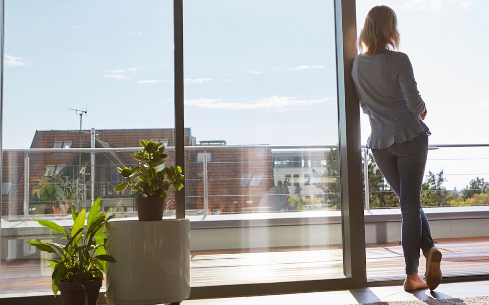 Cadillac We Have Your Back: Woman Looking Out Window