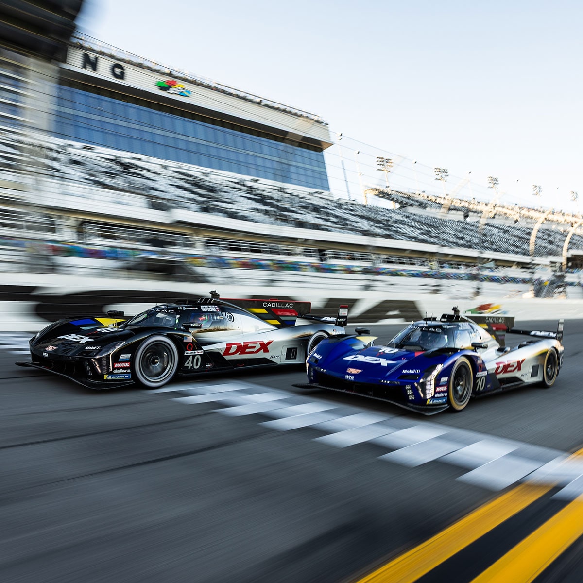 Front View of the Pink Cadillac V-Series.R Racecar Parked on a Race Track