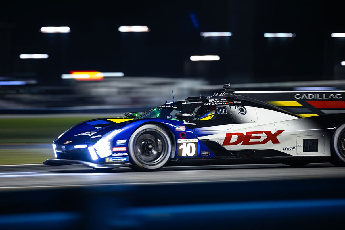 Close-up of the Front of a Red Cadillac CT4-V Driving Down a Track