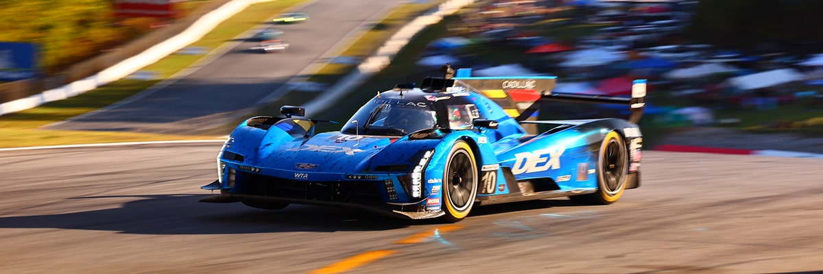 Three-quarters View of the Silver Cadillac V-Series.R Race Car Speeding on the Race Track