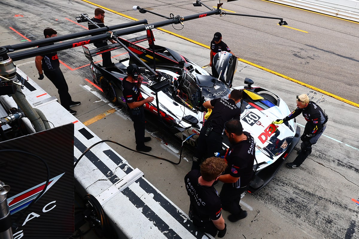 The Silver Cadillac V-Series.R Race Car Leading the Track Followed by Multiple Vehicles