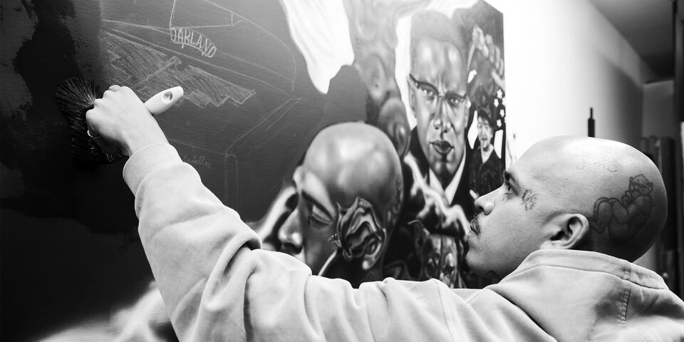 Close-up of Oakland Artist Esteban Samayoa Painting the Black and White Canvas "All in the Family"
