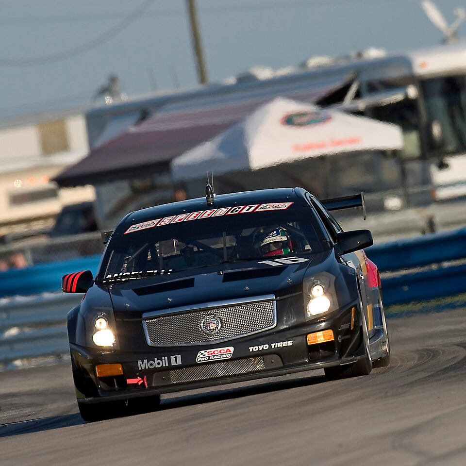 A Cadillac V.Series Vehicle Taking a Sharp Turn on the Sebring Track