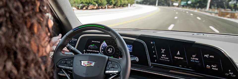 Interior View of Driver Driving Cadillac Vehicle