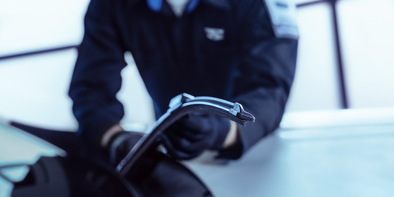Cadillac Technician Installing a New Tire on a Vehicle