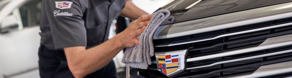 Cadillac Certified Service Technician Wipes Down Escalade Front Grill