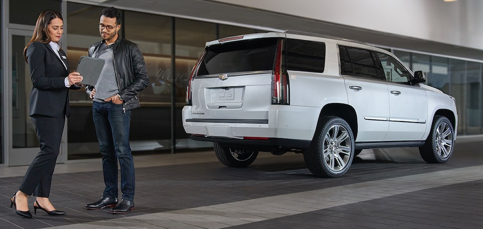Cadillac Protection expert shows customer Cadillac Escalade Luxury SUV
