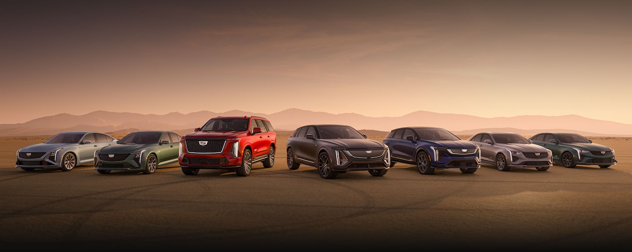 The Cadillac V-Series Vehicles Lined Up Next to Each Other in the Open Desert
