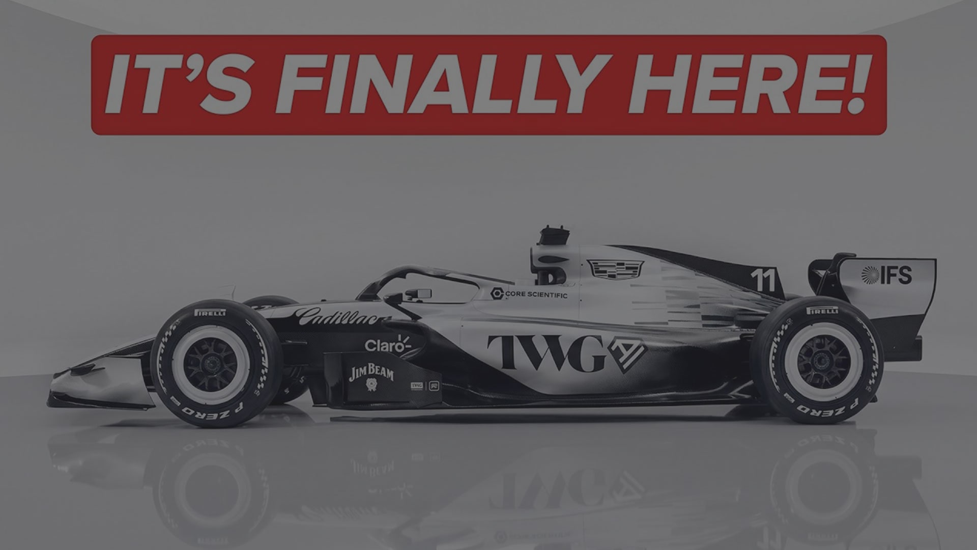 Black and White Side View of the Cadillac F1 Racecar with Text Overlay Reading "It's Finally Here"