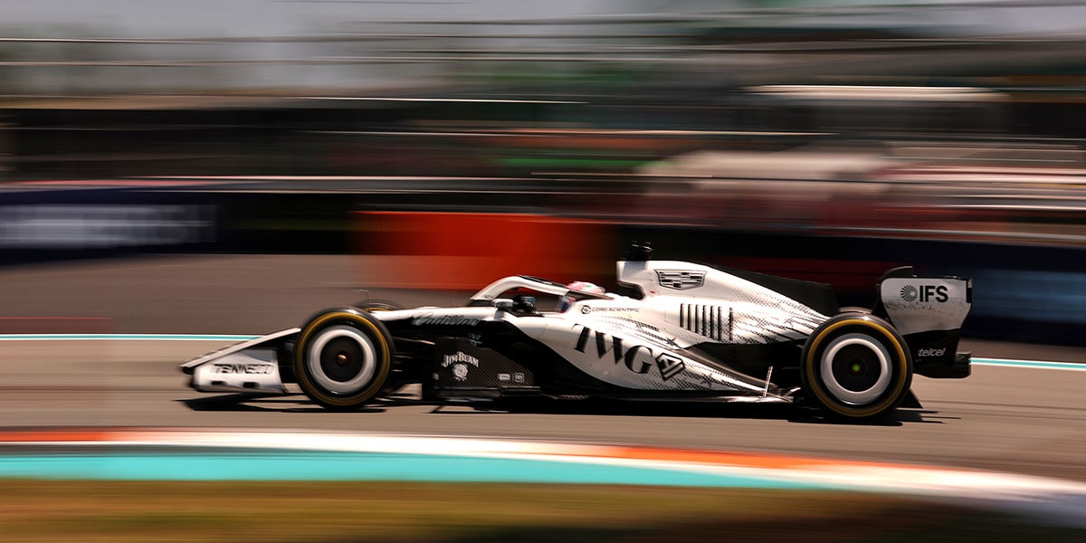 Rear Three-quarter View of a Cadillac Racecar Speeding Down a Track