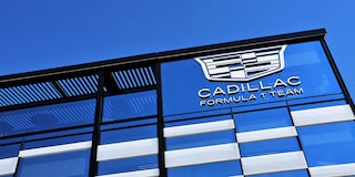 A Cadillac F1 Race Car Speeding Around a Racetrack