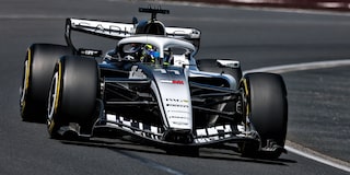 Front View of the White Cadillac F1 Racecar Parked on a Track