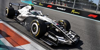 Front Three-quarters View of the White Cadillac F1 Race Car Parked on a Track