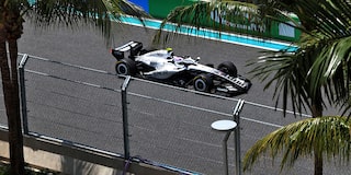 Front Three-quarters View of the White Cadillac F1 Race Car Parked on a Track