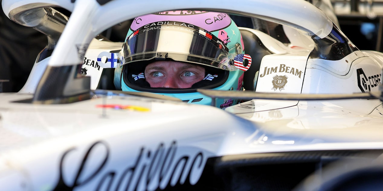 Front Three-quarters View of the White Cadillac F1 Race Car Parked on a Track