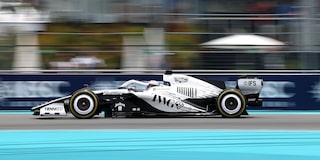 Front Three-quarters View of the White Cadillac F1 Race Car Parked on a Track