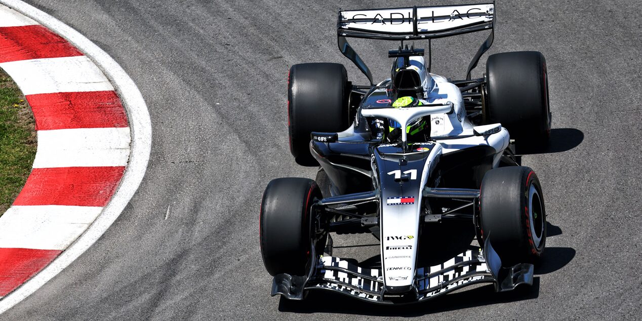 Overhead View of a Cadillac F1 Race Car Rounding a Track Corner