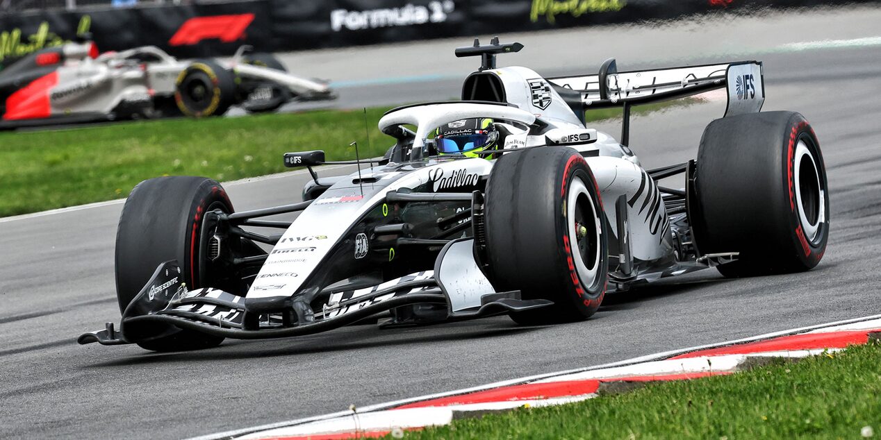 A Cadillac F1 Race Car Rounding a Corner on a Racetrack