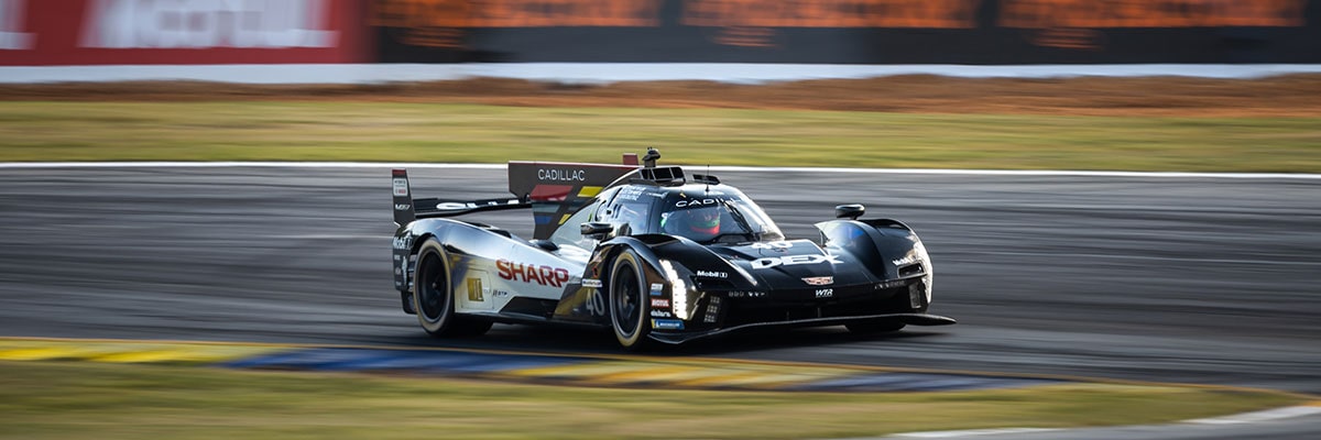 Front View of the Blue No.10 Cadillac V-Series.R Race Car Driving on a Race Track
