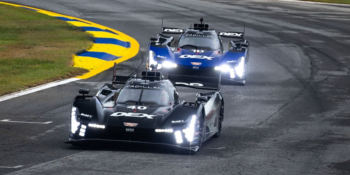 Bird's-eye View of the No.10 Blue Cadillac Racing Cadillac V-Series.R Race Car Approaching a Race Track Corner