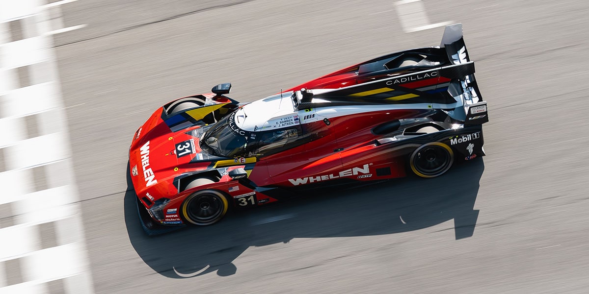The Blue No.10 Cadillac V-Series.R Race Car Speeding Along a Racetrack With Motion Blur