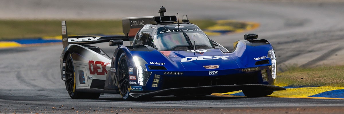 Three-quarter View of the No.40 Cadillac V-Series.R Race Car Speeding on a Race Track
